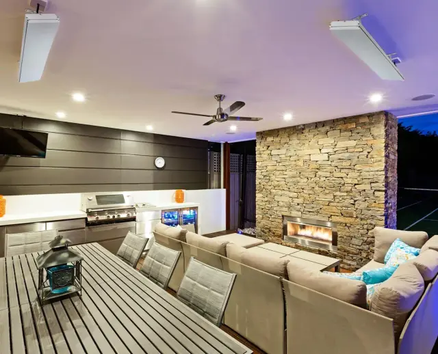 Heatstrip Elegance 2400W outdoor infrared heater integrated beneath the light-coloured ceiling of a conservatory
